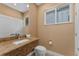 Elegant bathroom with granite vanity and a toilet at 3175 Brasilia Ave, Kissimmee, FL 34747