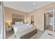 Main bedroom with plush bedding and ensuite bathroom at 3175 Brasilia Ave, Kissimmee, FL 34747