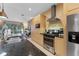 Modern kitchen with stainless steel appliances and light wood cabinets at 3175 Brasilia Ave, Kissimmee, FL 34747