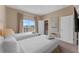 Spacious bedroom with two twin beds and access to balcony at 3175 Brasilia Ave, Kissimmee, FL 34747