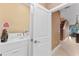 Convenient laundry room with washer, dryer, and access to stairs at 3175 Brasilia Ave, Kissimmee, FL 34747