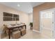 Bright dining area with table for six and adjacent half-bathroom at 3175 Brasilia Ave, Kissimmee, FL 34747