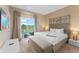 Main bedroom with king-size bed and private balcony access at 3175 Brasilia Ave, Kissimmee, FL 34747
