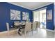 Elegant dining room with table and chairs, and access to outdoor patio at 2709 Scrapbook St, Kissimmee, FL 34746