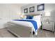 Spacious Primary bedroom with a king-size bed and modern nightstands at 2709 Scrapbook St, Kissimmee, FL 34746
