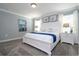 Primary bedroom with a king-size bed and coastal decor at 2709 Scrapbook St, Kissimmee, FL 34746