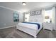 Primary bedroom with a king-size bed and coastal decor at 2709 Scrapbook St, Kissimmee, FL 34746