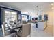 Open concept kitchen with dining area and view into living room at 2709 Scrapbook St, Kissimmee, FL 34746