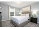 Bedroom with a queen-size bed and city-themed art at 2709 Scrapbook St, Kissimmee, FL 34746
