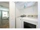 Bright laundry room with washer, dryer, and shelving at 2709 Scrapbook St, Kissimmee, FL 34746