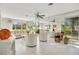 Bright living room with white tile floors and mirrored walls at 899 Jonathan Way # 899, Altamonte Springs, FL 32701