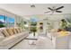 Bright living room with mirrored wall, comfy sofas, and a large coffee table at 899 Jonathan Way # 899, Altamonte Springs, FL 32701