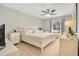 Main bedroom with king-size bed, ceiling fan, and ample natural light at 899 Jonathan Way # 899, Altamonte Springs, FL 32701
