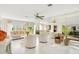 Bright living room with white tile floors and mirrored walls at 899 Jonathan Way # 899, Altamonte Springs, FL 32701