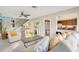 Open concept living room with views into kitchen and access to staircase at 899 Jonathan Way # 899, Altamonte Springs, FL 32701
