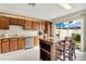 Kitchen with granite countertops, wooden cabinetry, and breakfast bar at 899 Jonathan Way # 899, Altamonte Springs, FL 32701