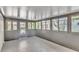 Bright screened porch with concrete floor and sliding glass doors at 126 Maple Dr, Debary, FL 32713