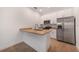 Modern kitchen with stainless steel appliances and granite counters at 1646 Cumin Dr, Poinciana, FL 34759