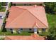 Back exterior of house featuring a red tile roof at 1646 Cumin Dr, Poinciana, FL 34759