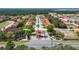 Community entrance with guardhouse and landscaping at 1646 Cumin Dr, Poinciana, FL 34759