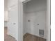 Laundry closet with wire shelving and a built in hamper at 1646 Cumin Dr, Poinciana, FL 34759
