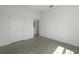Spacious bedroom with two doors and grey tile floors at 1646 Cumin Dr, Poinciana, FL 34759