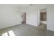 Bedroom with tile floors and access to bathroom at 1646 Cumin Dr, Poinciana, FL 34759