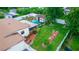 Aerial view showcasing a home's backyard, landscaping, and shed at 966 Shorecrest Ave, Deltona, FL 32725