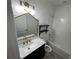 Stylish bathroom with marble vanity, gold fixtures, and a bathtub at 625 Disa Dr, Davenport, FL 33837