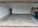 Clean and empty garage with painted walls at 625 Disa Dr, Davenport, FL 33837