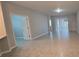 Spacious living room with tile floors and access to backyard at 1007 Theodore St, Davenport, FL 33837