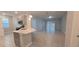 Open concept kitchen with island and stainless steel appliances at 1007 Theodore St, Davenport, FL 33837