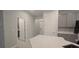 Kitchen features gray cabinets, white countertops and a pantry at 1007 Theodore St, Davenport, FL 33837