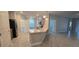 Modern kitchen features a large island, stainless steel appliances, and light gray cabinets at 1007 Theodore St, Davenport, FL 33837