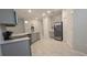Modern kitchen with gray cabinets and stainless steel appliances at 1007 Theodore St, Davenport, FL 33837