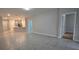 Spacious living room with tile floors and access to other rooms at 1007 Theodore St, Davenport, FL 33837