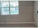 Bright living room with large window and tile flooring at 1007 Theodore St, Davenport, FL 33837