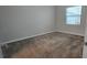 Spacious bedroom with neutral walls and gray carpeting at 1007 Theodore St, Davenport, FL 33837