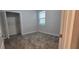 Spacious bedroom with neutral walls and carpeted floors at 1007 Theodore St, Davenport, FL 33837
