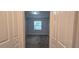 Well-lit bedroom with gray carpeting and double door closets at 1007 Theodore St, Davenport, FL 33837