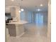 Open concept kitchen with island and stainless steel appliances at 1007 Theodore St, Davenport, FL 33837