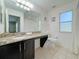 Bathroom with granite vanity, toilet and bathtub at 319 Verona Ave, Davenport, FL 33897