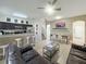 Open concept living space with kitchen, dining and living areas at 319 Verona Ave, Davenport, FL 33897