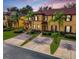 Two-story townhome with brick paver driveway and lush landscaping at 319 Verona Ave, Davenport, FL 33897