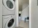 Stackable washer and dryer in a small laundry room at 319 Verona Ave, Davenport, FL 33897