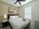 Cozy bedroom with a double bed, nightstand, and window coverings at 319 Verona Ave, Davenport, FL 33897
