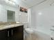 Clean bathroom with granite countertop, toilet and shower at 319 Verona Ave, Davenport, FL 33897