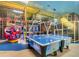 Two air hockey tables in a vibrant play area at 319 Verona Ave, Davenport, FL 33897