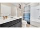 Bathroom with shower/tub combo and dark vanity at 4738 Terrasonesta Dr, Davenport, FL 33837