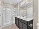 Modern bathroom with double vanity and a large walk-in shower at 4738 Terrasonesta Dr, Davenport, FL 33837